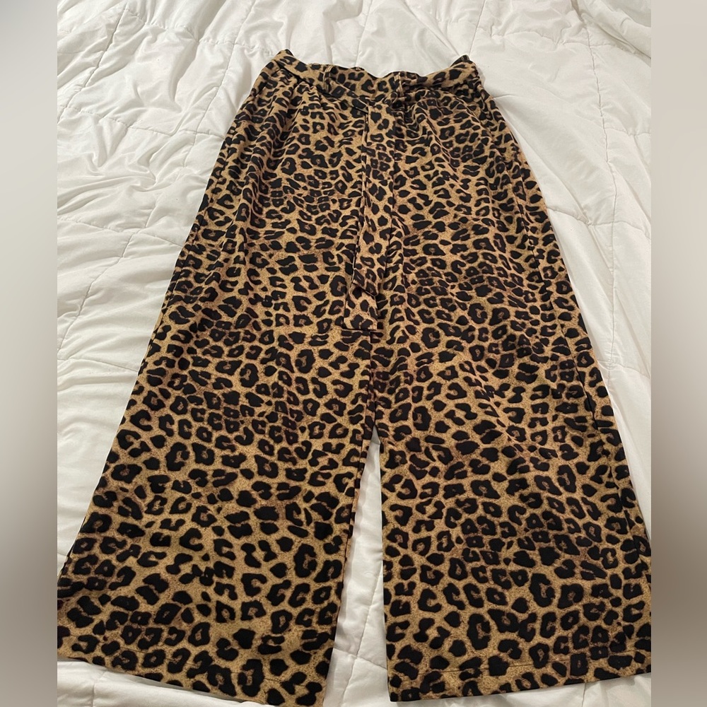 Wide leg leopard print pants. Ties in front. Elastic waist. NWT